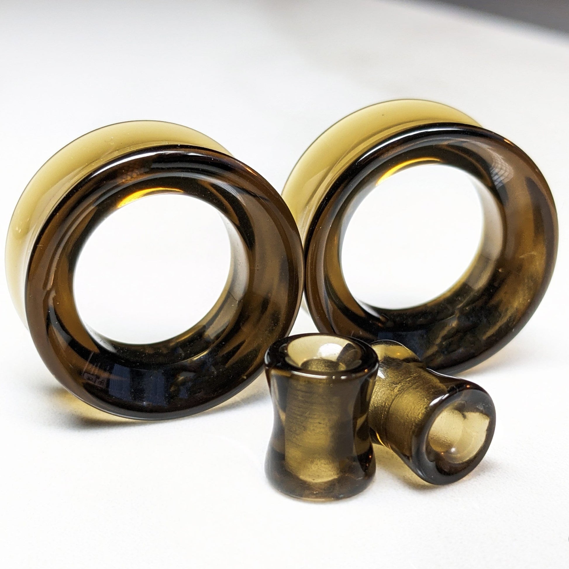 Brown Glass Tunnels for stretched ears.