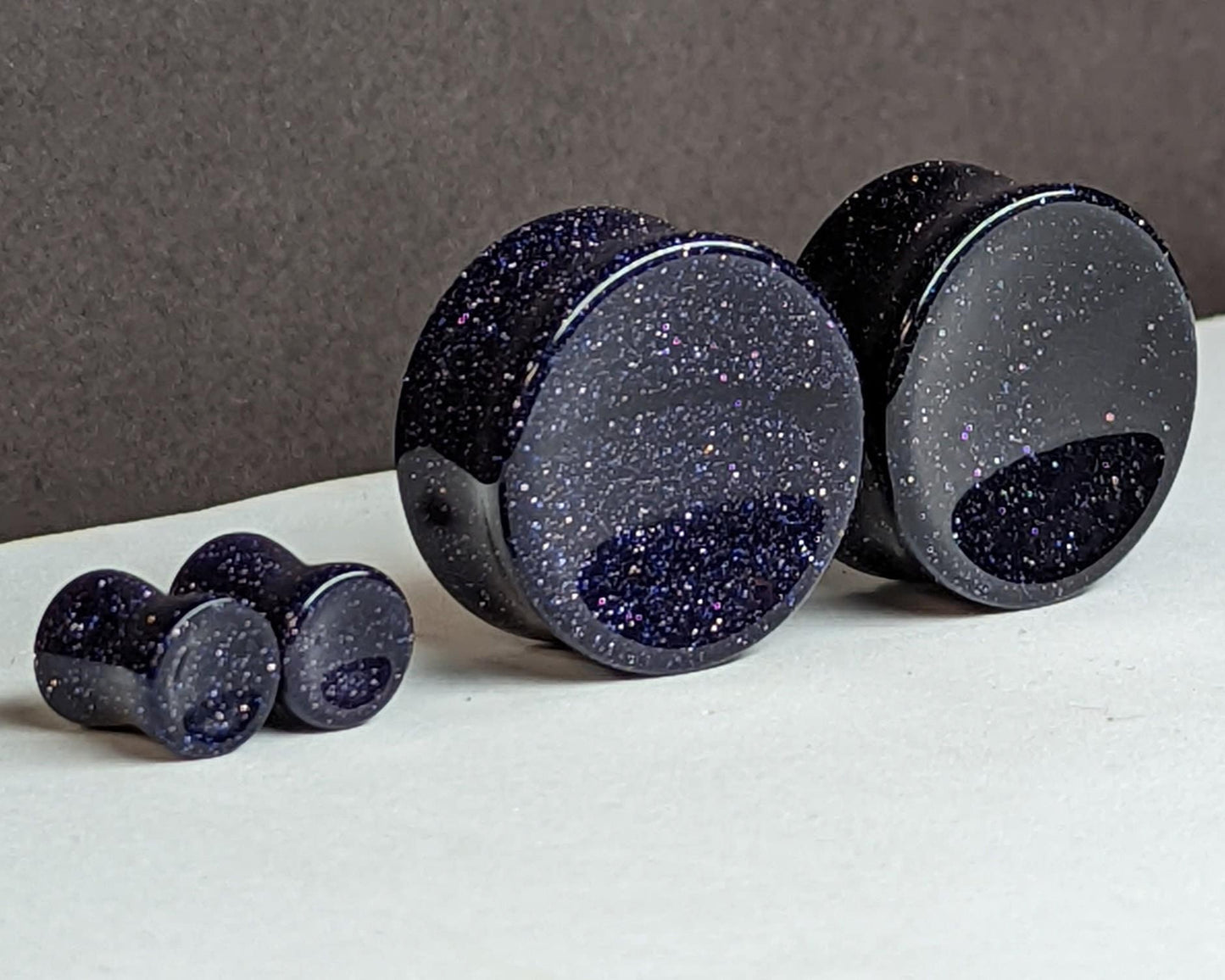 Concave Blue Goldstone Glass Plugs for stretched ears.