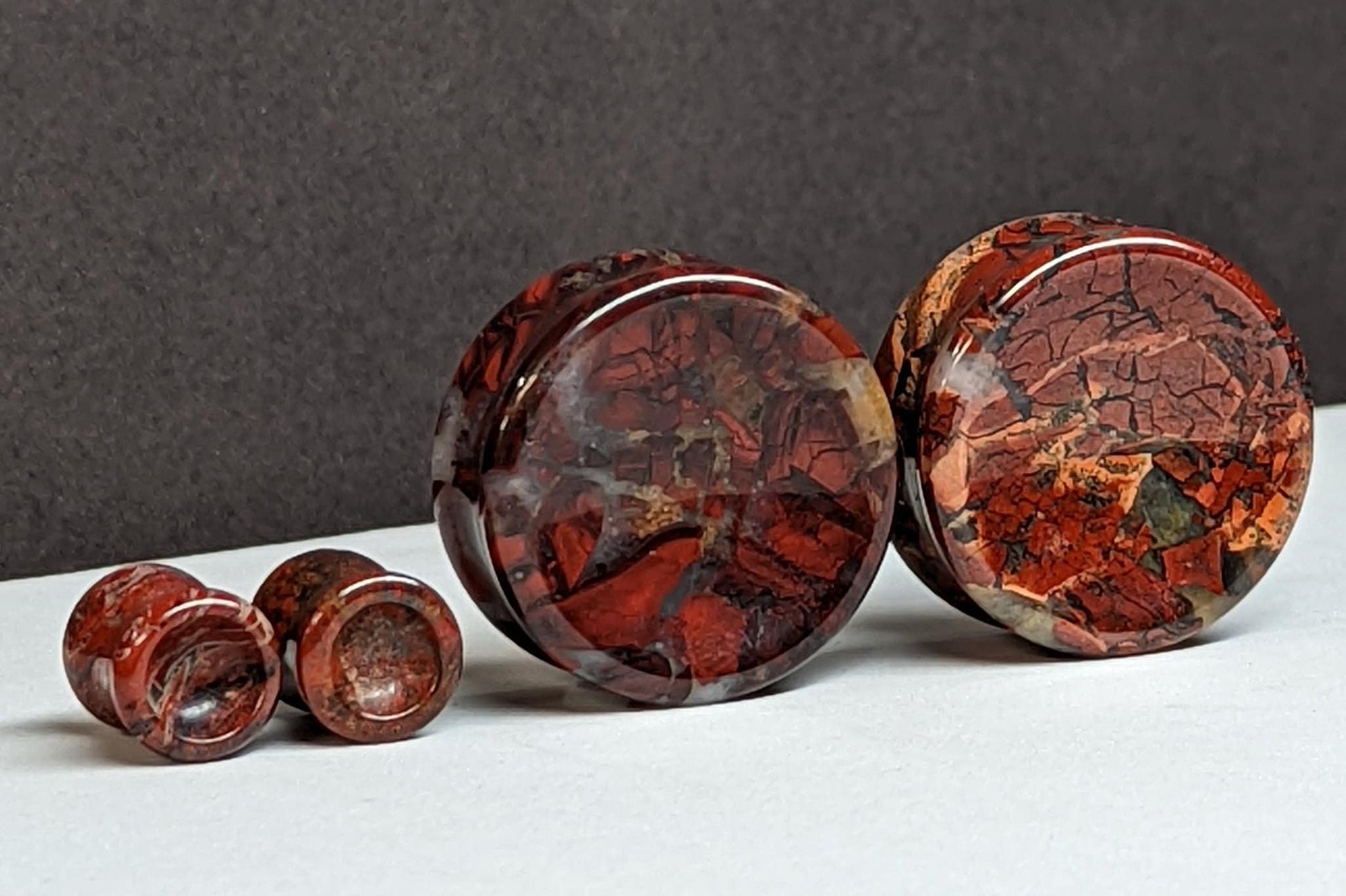 Concave Brecciated Stone Plugs for stretched ears.