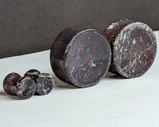 Concave Chicken Blood Stone Plugs for stretched ears.