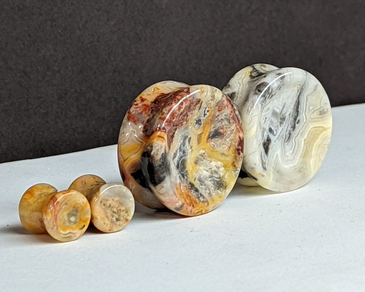 Concave Crazy Lace Agate Stone Plugs for stretched ears.