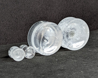 Concave Crystal glass plugs for stretched ears. 