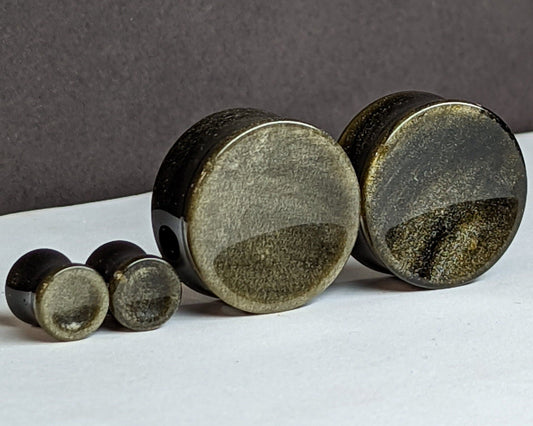 Concave Golden Obsidian Stone Plugs for stretched ears.