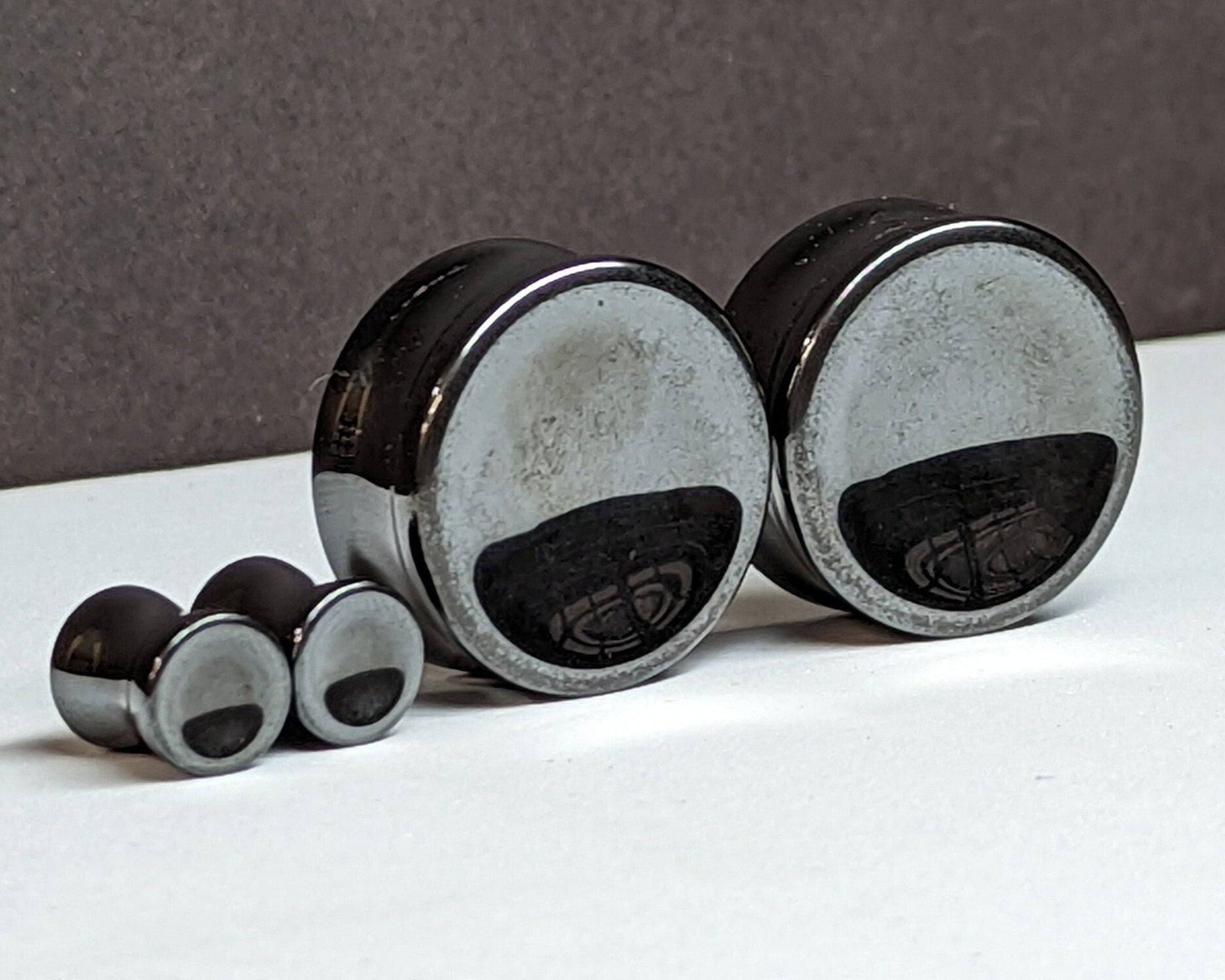 Concave Hematite Stone Plugs for stretched ears.