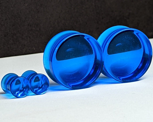 Concave Ocean Blue Glass Plugs for stretched ears. 