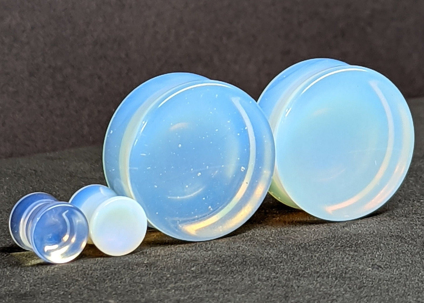Concave Opalite Glass Plugs for stretched ears.