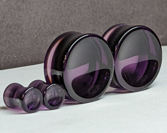 Concave Purple Glass Plugs for stretched ears