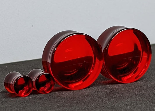Concave Red Glass Plugs for stretched ears. 