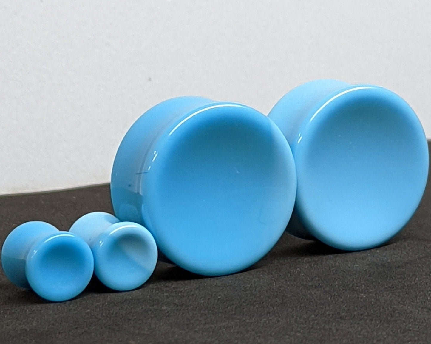 Concave Teal Glass Plugs for stretched ears