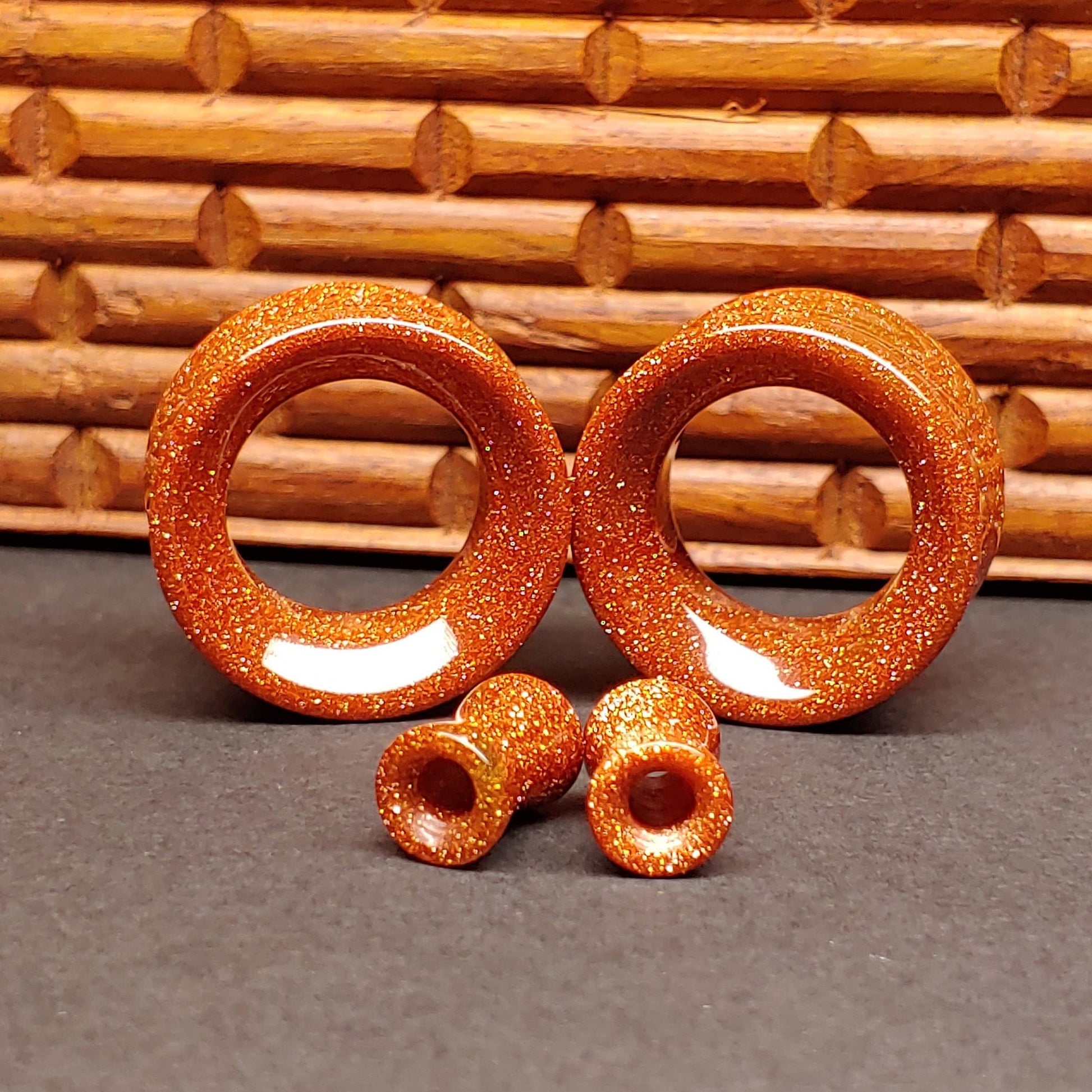 Goldstone glass tunnels for stretched ears.