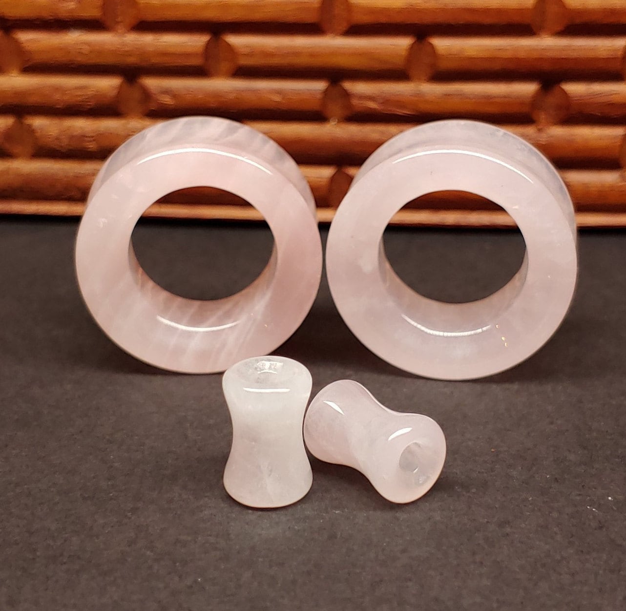 Pink quartz tunnels for stretched ears. 