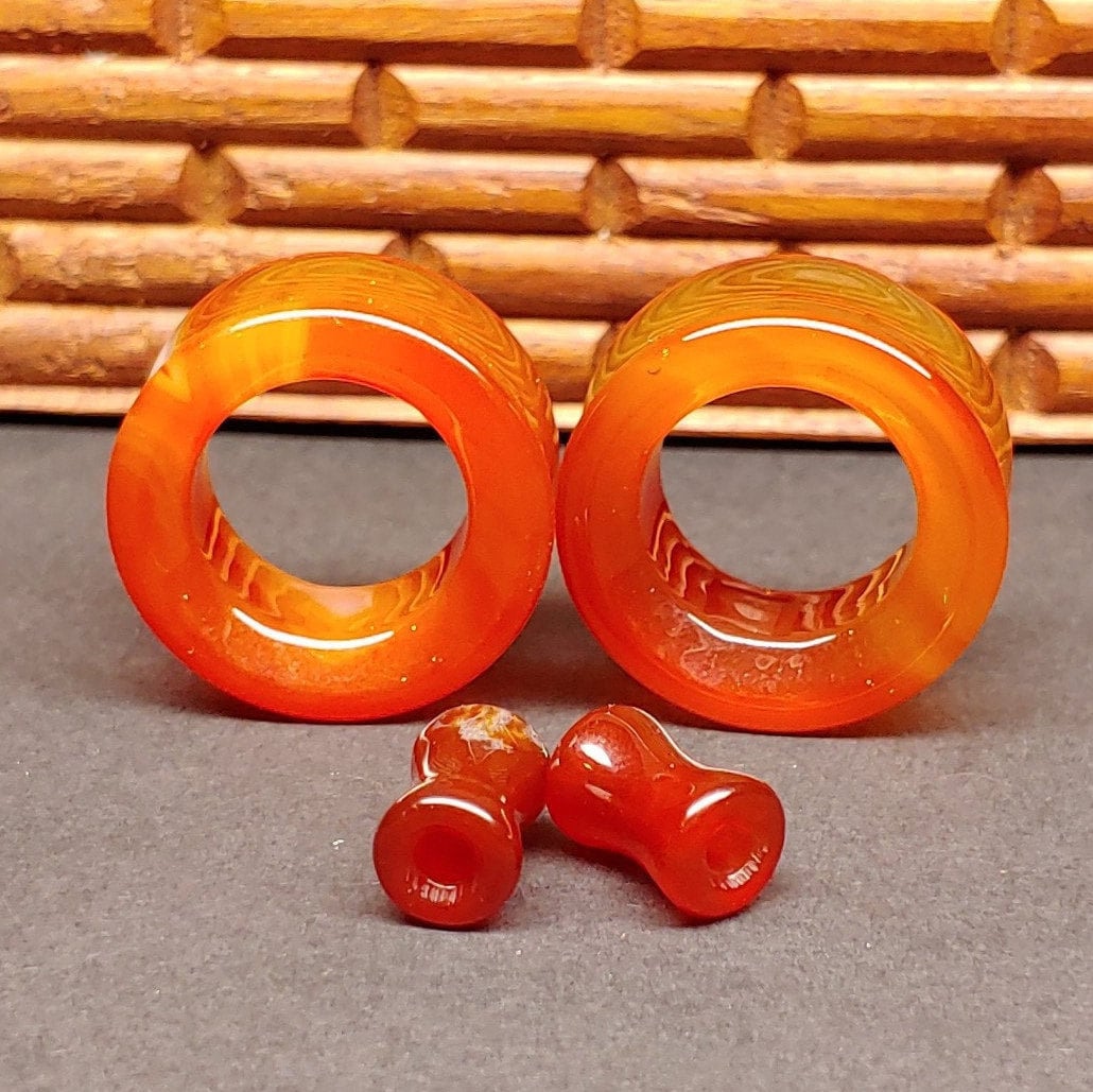 Red Agate tunnels for stretched ears. 