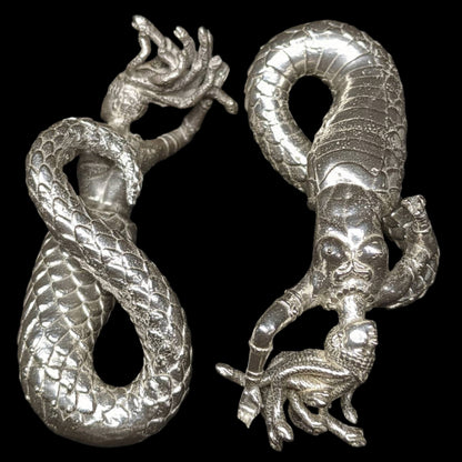 Silver medusa ear weights for stretched ears. Weights hang from your lobe by medusas' tail. 